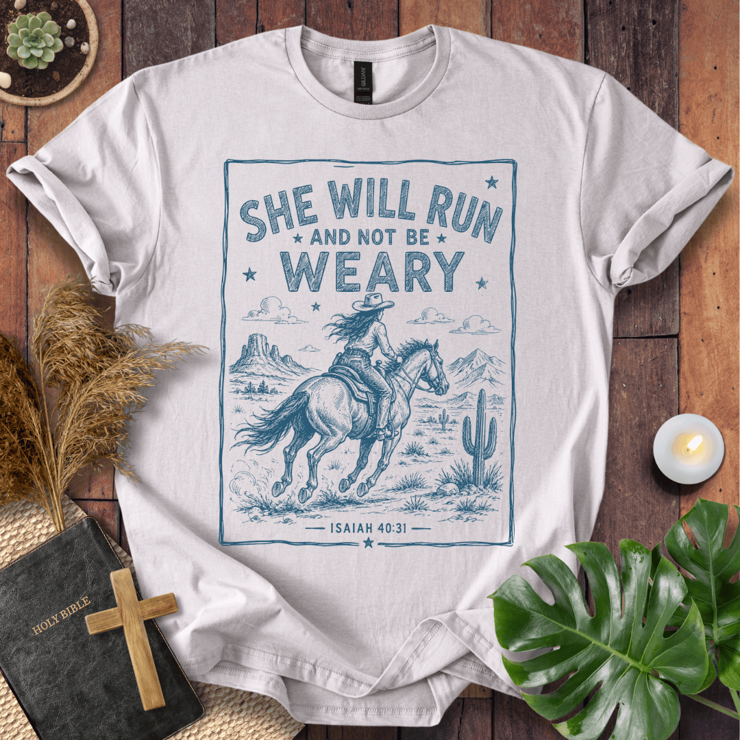 graphic tee with a blue sketch of a cowgirl riding a horse in the desert under Isaiah forty thirty-one text.
