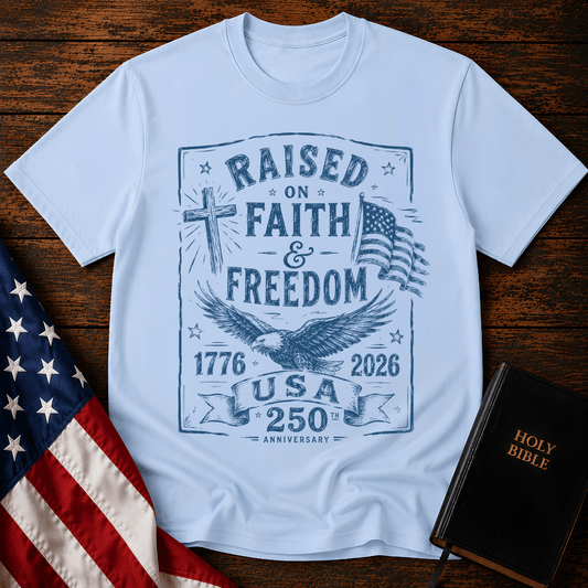Patriotic Christian t shirts for women with a blue sketch of a cross, eagle, American flag, and 1776-2026.