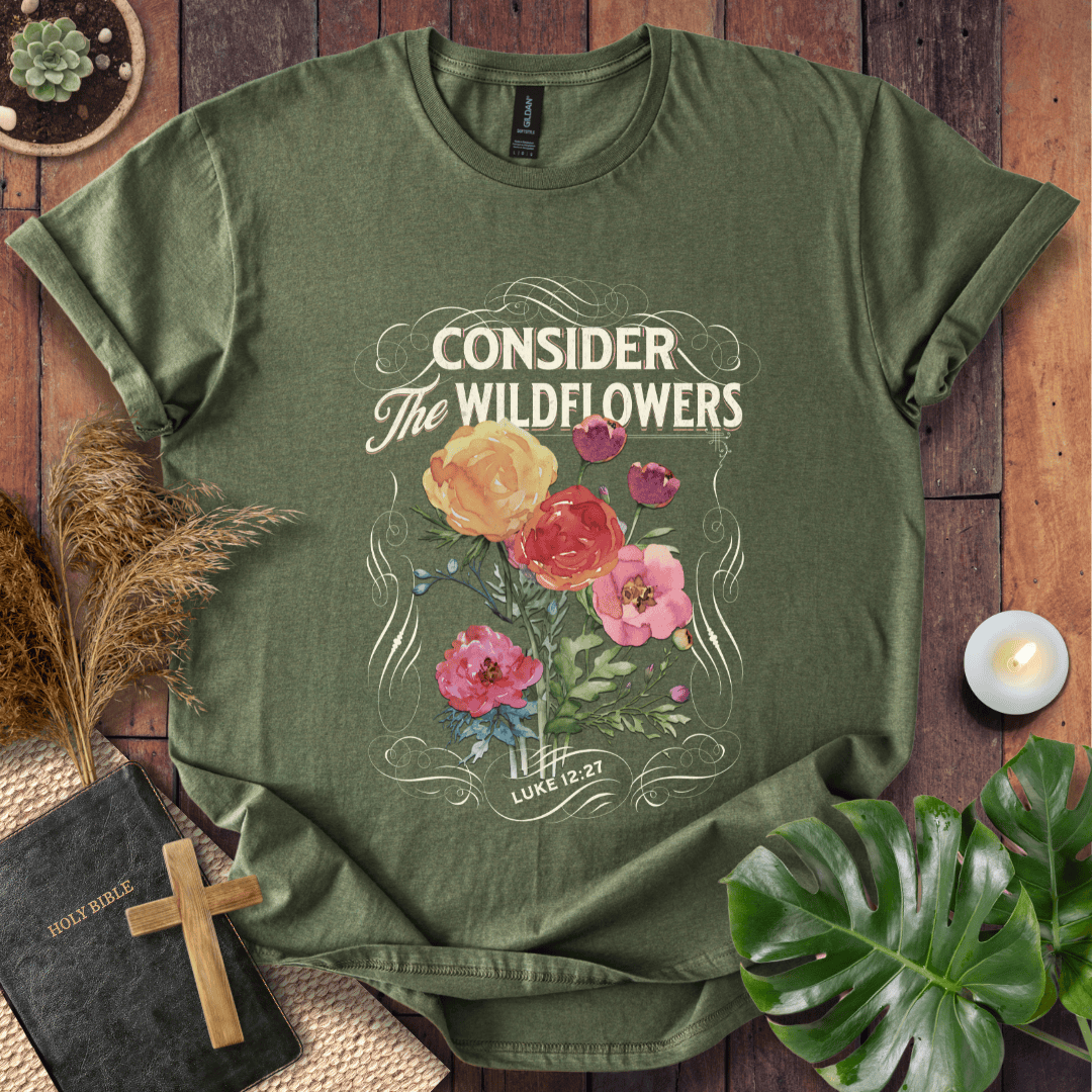 Christian t-shirt with watercolor wildflowers and Luke 12:27 scripture "Consider the Wildflowers" in a vintage scroll frame.