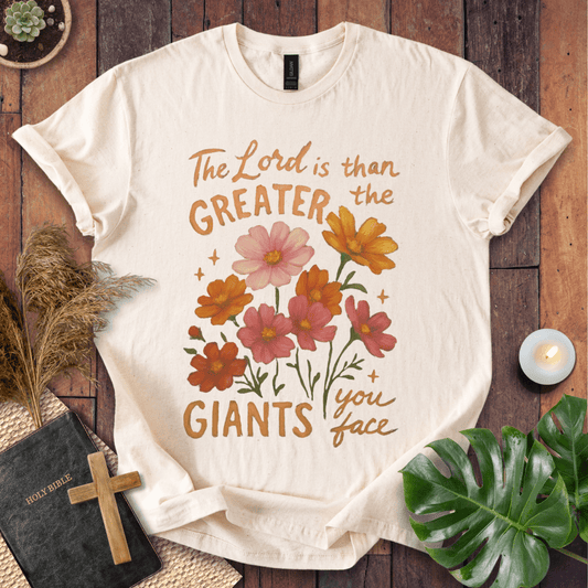 “The Lord is greater than the giants you face” floral lettering Christian t-shirt; uplifting faith tee.
