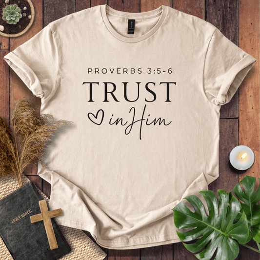 Minimalist Proverbs 3:5-6 Trust in Him shirt for women, a boho style bible verse t shirt on a wooden background.