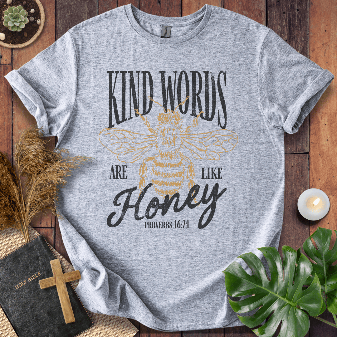 Proverbs 16:24 "Kind Words Are Like Honey" t-shirt featuring a vintage gold honeybee graphic and rustic text.
