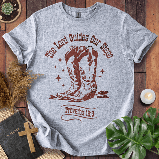 Proverbs 16:9 Christian t shirts for women featuring vintage cowboy boots and "The Lord Guides Our Steps"