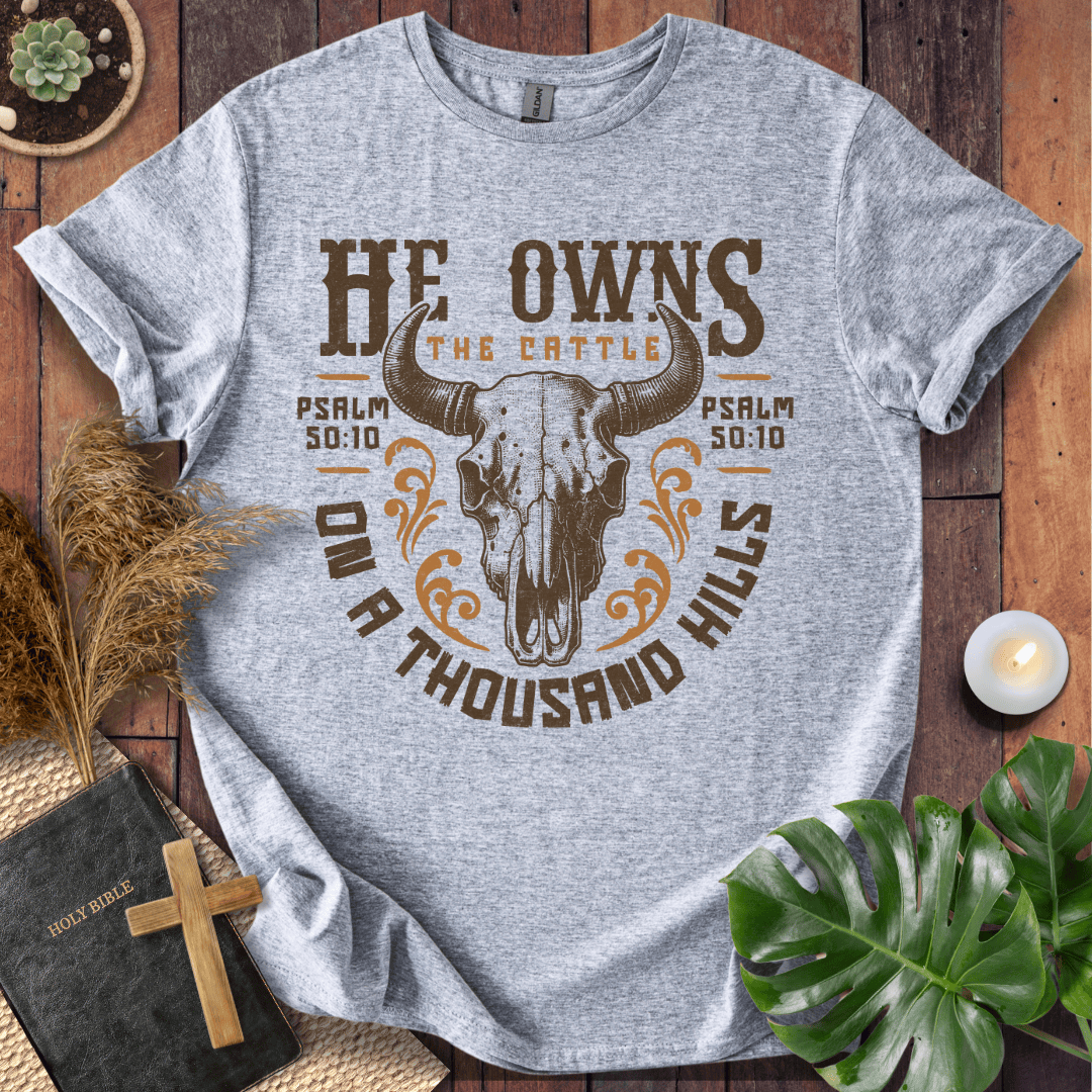 Christian t shirt for women featuring a longhorn skull and Psalm 50:10 He owns the cattle on a thousand hills.
