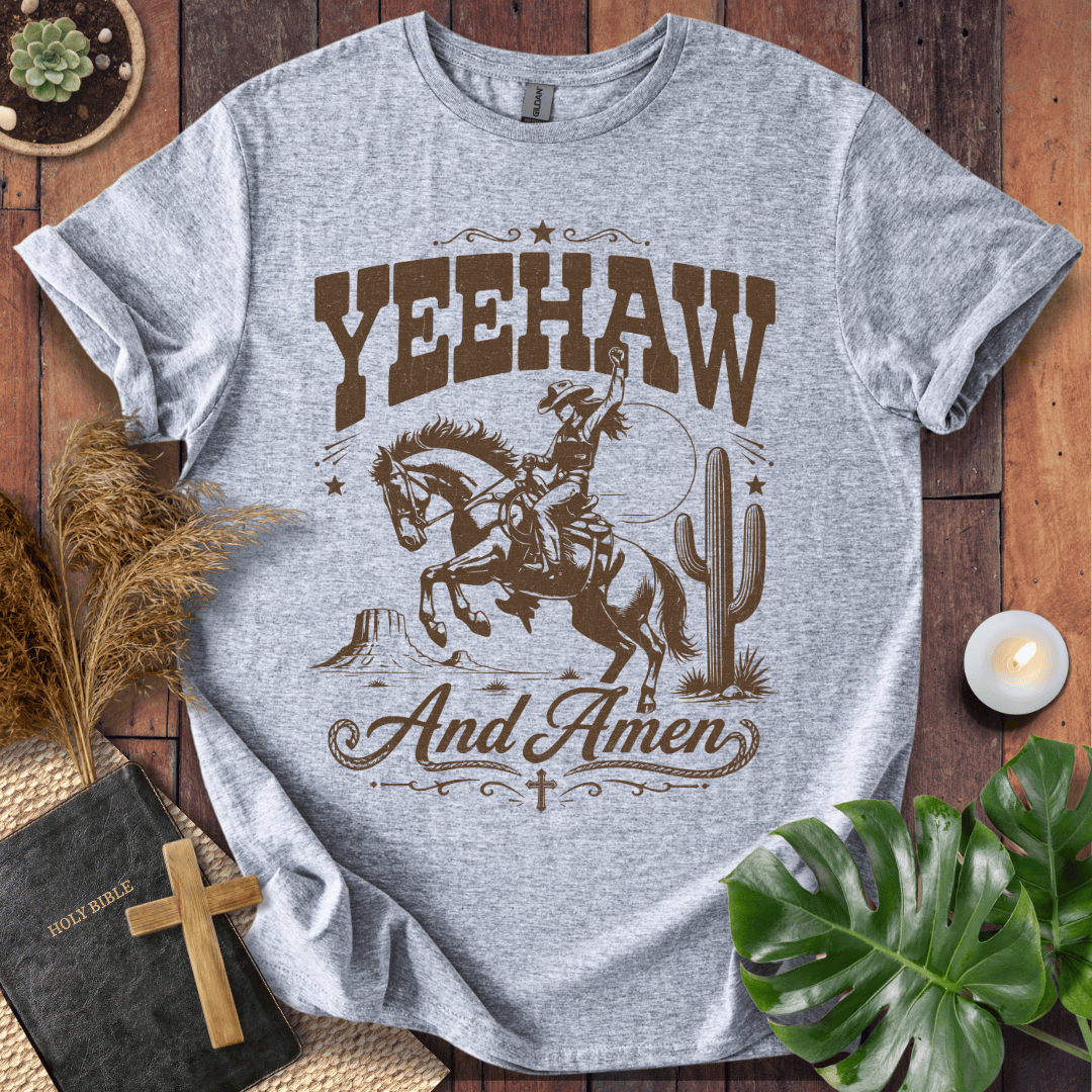 Yeehaw and Amen Christian t shirt for women featuring a vintage brown graphic of a cowgirl riding a bucking horse.