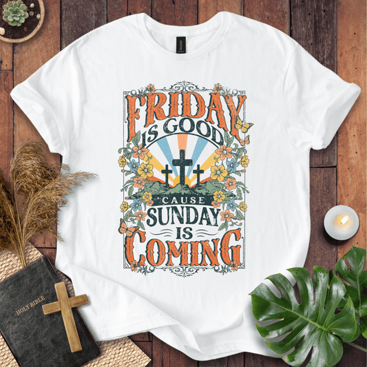 Christian Easter t-shirt featuring "Friday is Good Cause Sunday is Coming" vintage design with three crosses and wildflowers.