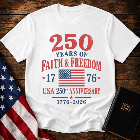 Patriotic t-shirt reading 250 Years of Faith and Freedom 1776 to 2026 with an American flag on a wood
