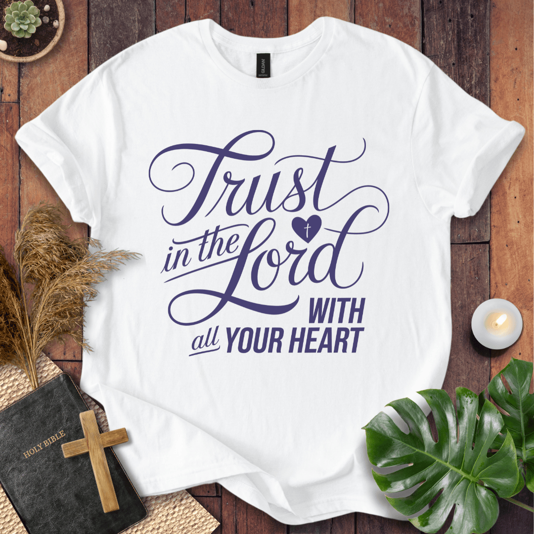 Proverbs 3:5 Trust in the Lord script design on a Christian t shirt for women styled with a bible and cross.