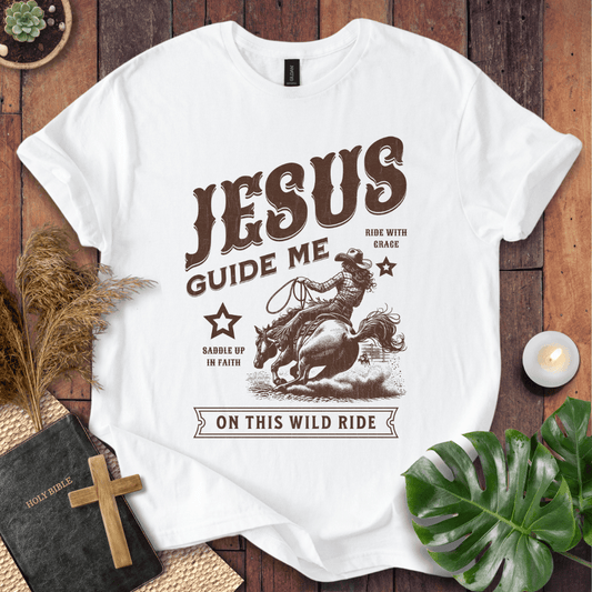 Vintage style t-shirt with a cowgirl riding a horse and text reading Jesus Guide Me On This Wild Ride.
