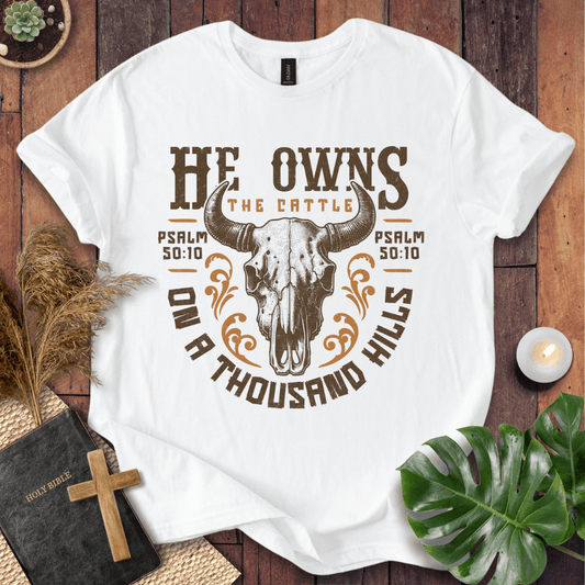 Christian t shirt for women featuring a longhorn skull and Psalm 50:10 He owns the cattle on a thousand hills.
