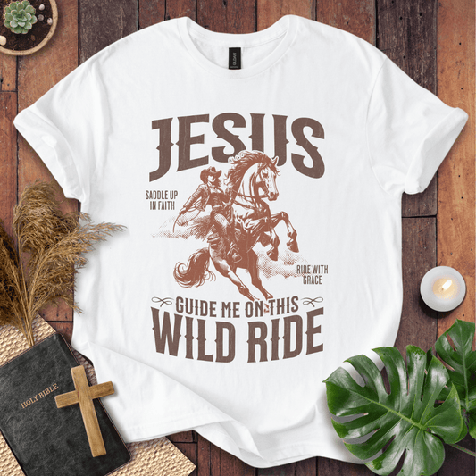 White t-shirt with graphic design featuring a horse and text on a wooden surface.