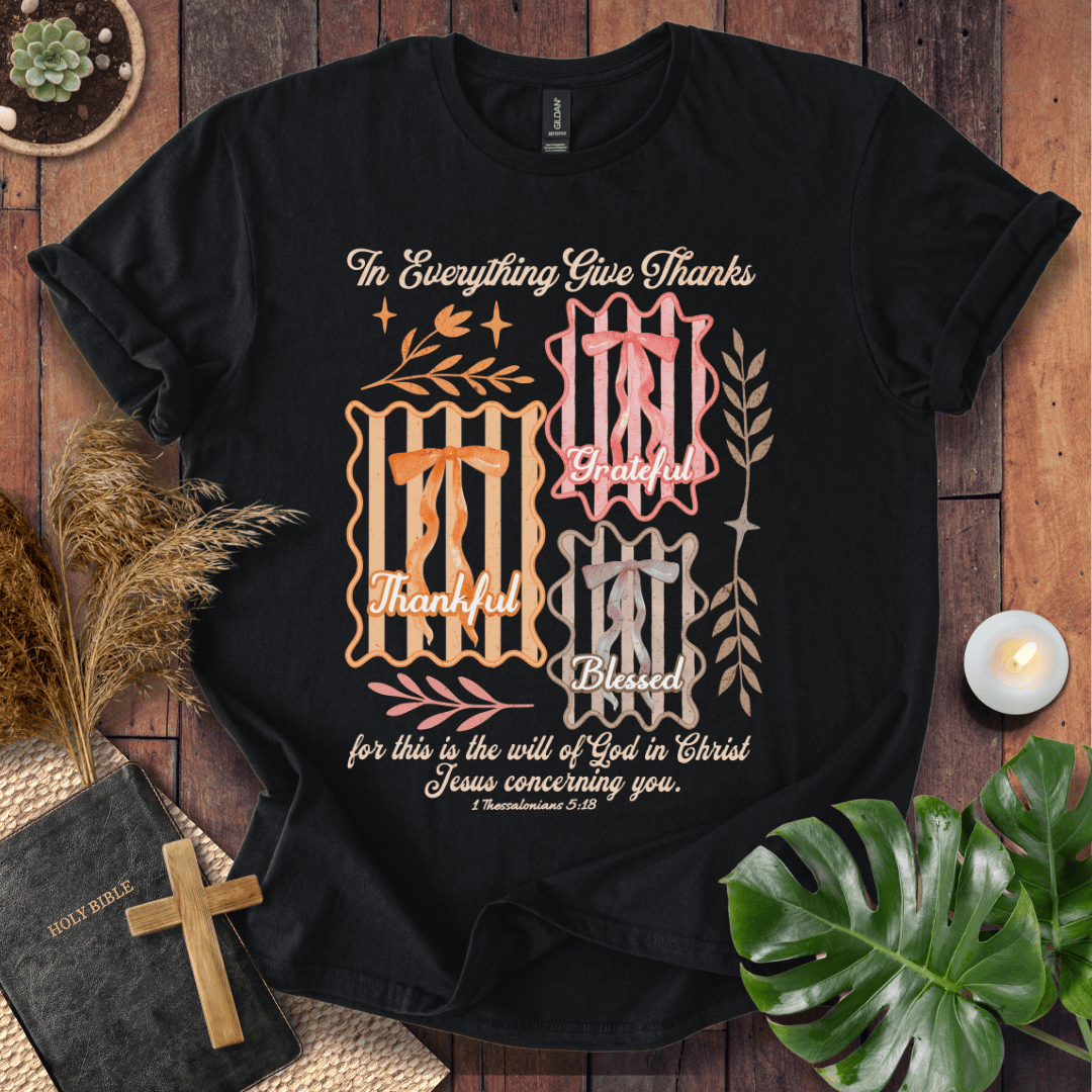 Christian t-shirt with "In Everything Give Thanks" 1 Thessalonians 5:18 verse, pink bows, and botanical vintage graphics.
