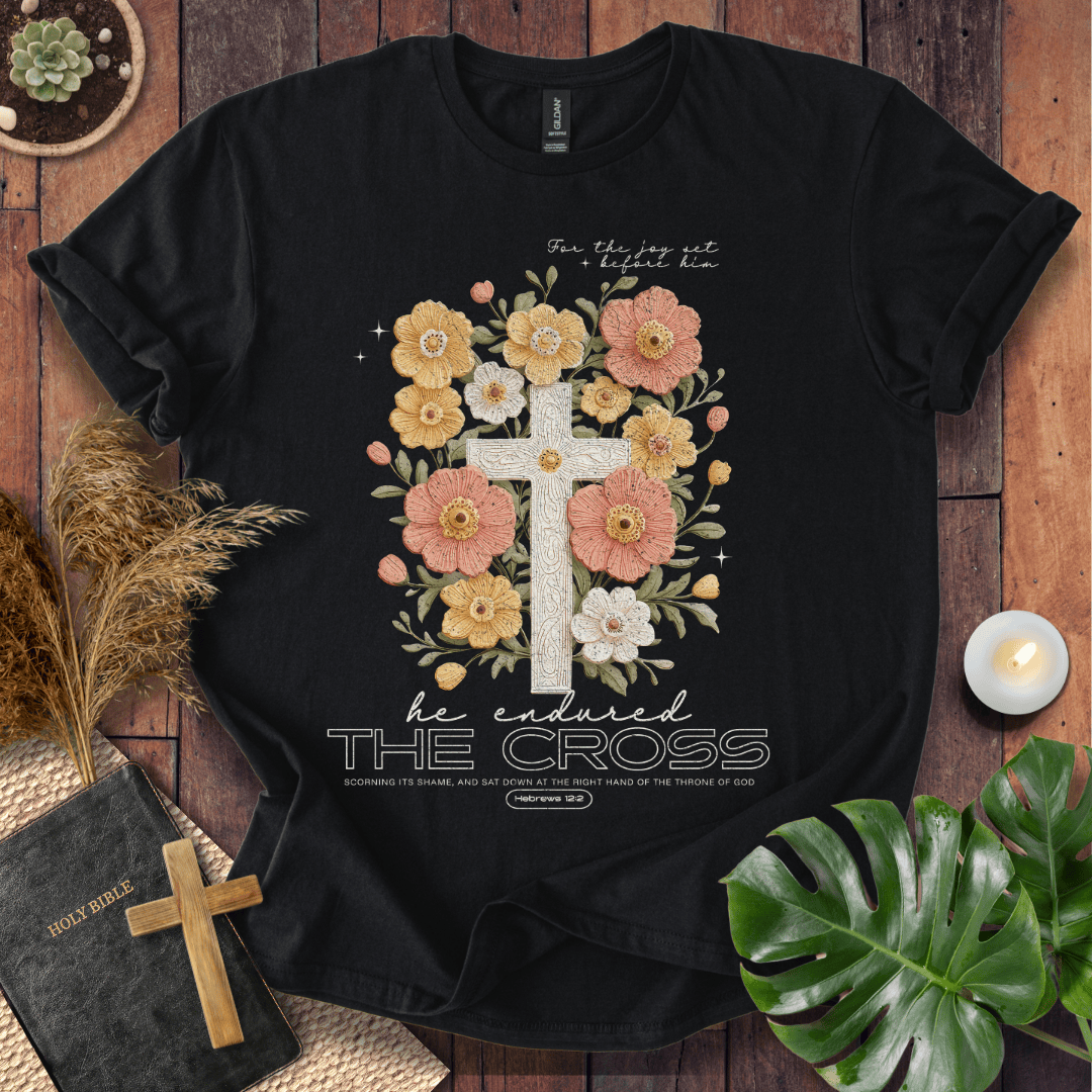 Easter-shirt with a cross and peach flowers featuring Hebrews 12:2 scripture, an essential in women's Christian tees.