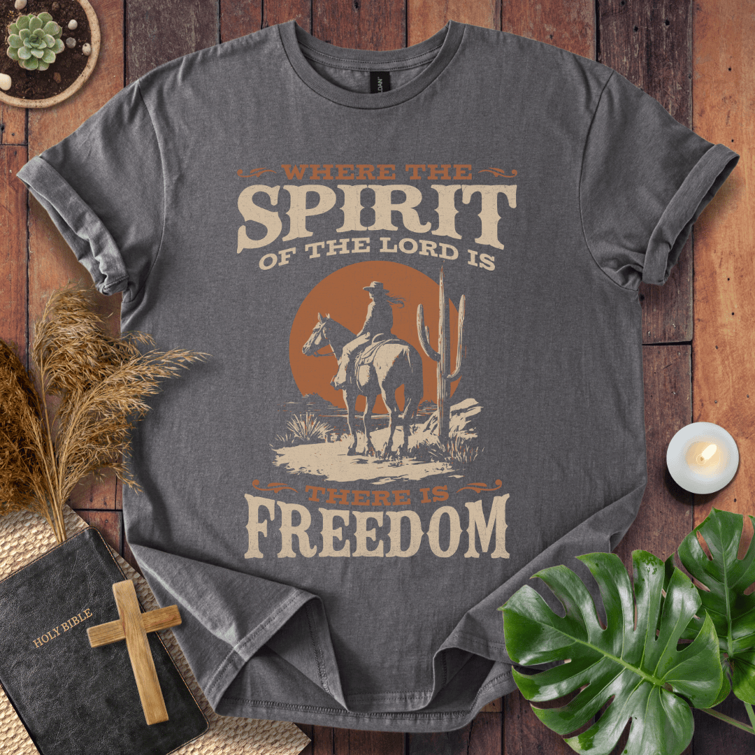 Western t-shirt featuring a horse rider, cactus, and sunset with the bible verse Where the Spirit of the Lord is there is Freedom.