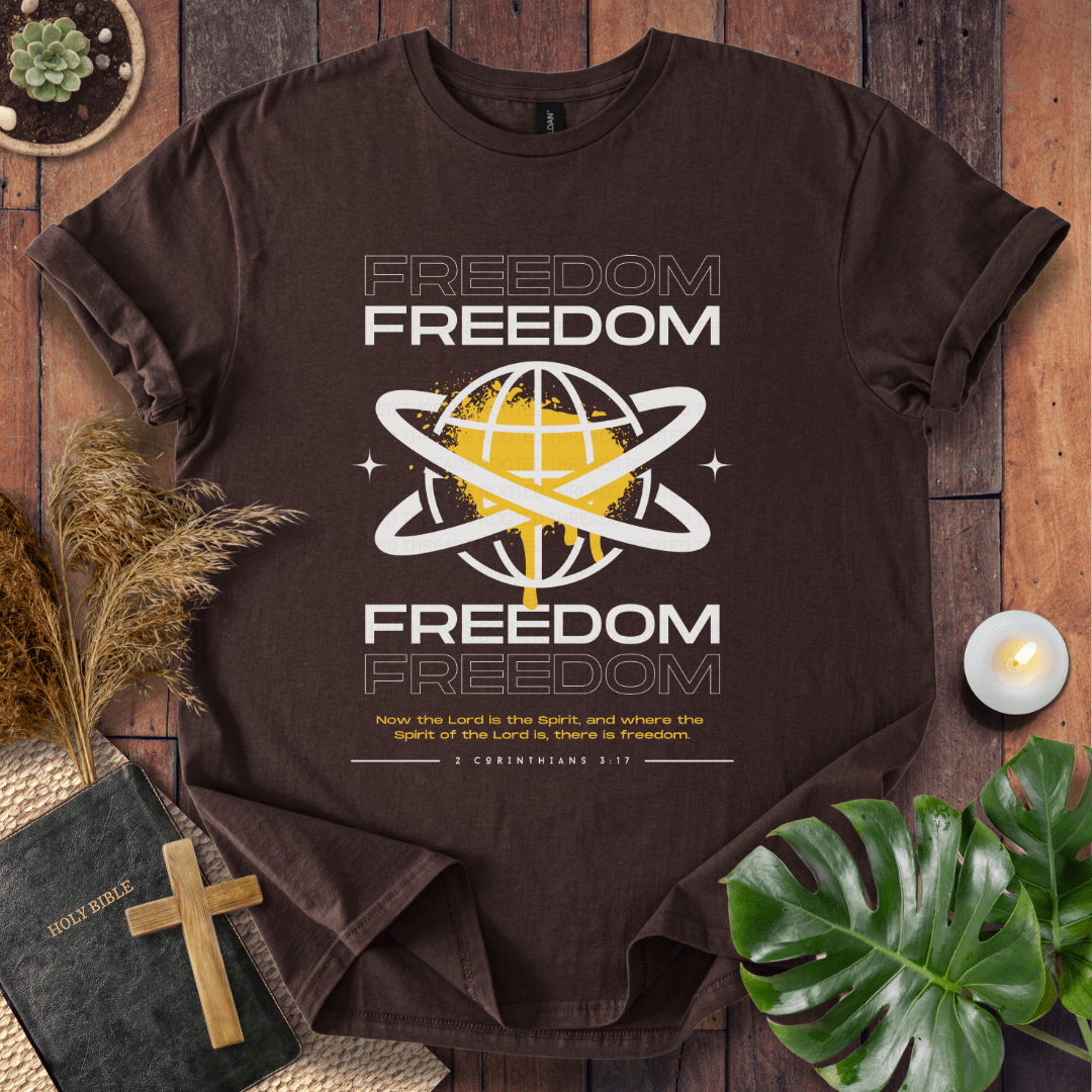 Freedom Christian t-shirt—modern globe with orbit rings and verse 2 Corinthians 3:17 about the Spirit and freedom.