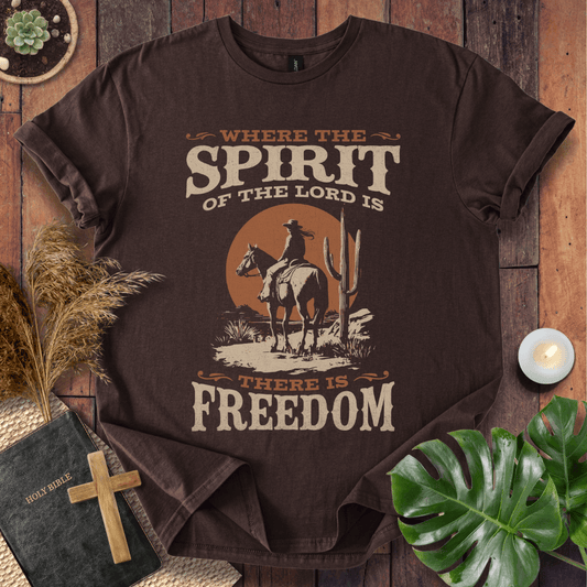 Western t-shirt featuring a horse rider, cactus, and sunset with the bible verse Where the Spirit of the Lord is there is Freedom.