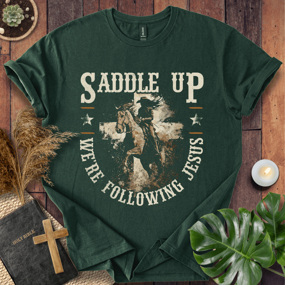 t-shirt featuring a horse and rider silhouette on a cross with text Saddle Up We're Following Jesus in a vintage style.