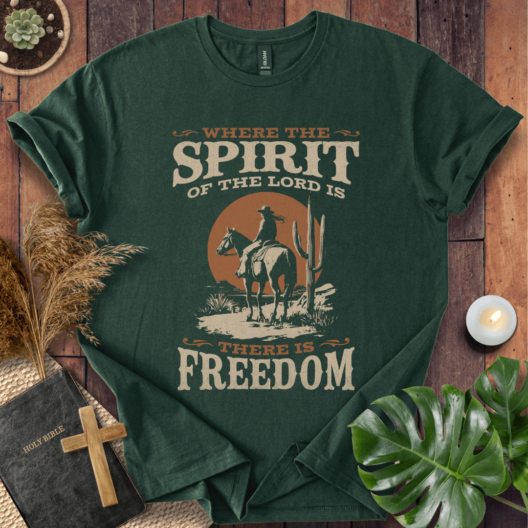Western t-shirt featuring a horse rider, cactus, and sunset with the bible verse Where the Spirit of the Lord is there is Freedom.