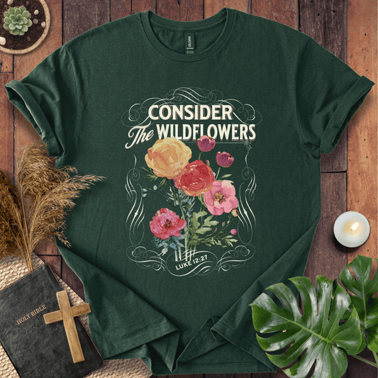 Christian t-shirt with watercolor wildflowers and Luke 12:27 scripture "Consider the Wildflowers" in a vintage scroll frame.