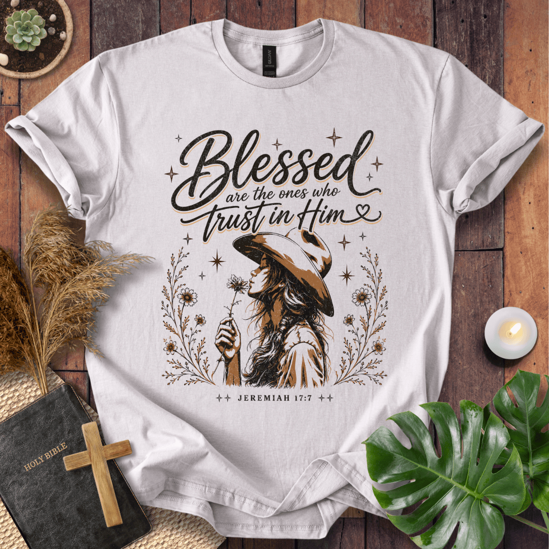 Jeremiah 17:7 sand t-shirt featuring a western woman in a cowboy hat holding a flower with stars and branches.