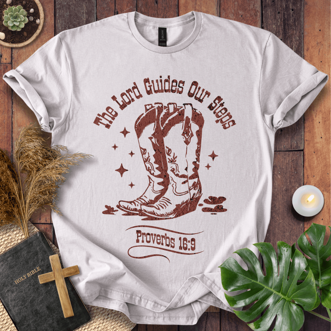 Proverbs 16:9 Christian t shirts for women featuring vintage cowboy boots and "The Lord Guides Our Steps"