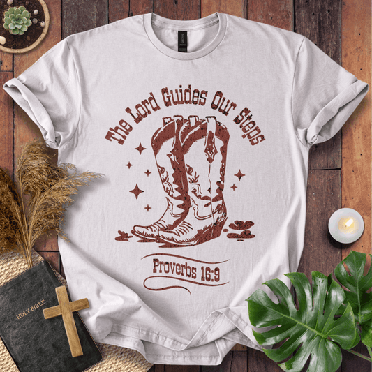 Proverbs 16:9 Christian t shirts for women featuring vintage cowboy boots and "The Lord Guides Our Steps"