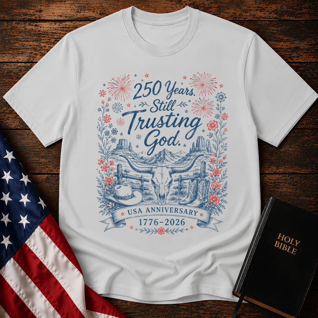 patriotic western graphic tee featuring a longhorn skull, cowboy boots, fireworks, and 1776-2026 text.