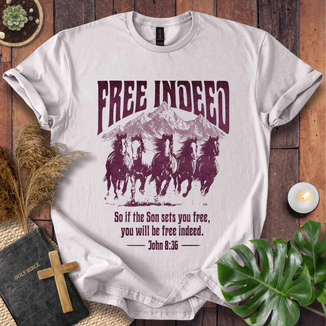 t-shirt featuring five wild horses, mountains, and John 8:36 "Free Indeed" in a vintage distressed print.