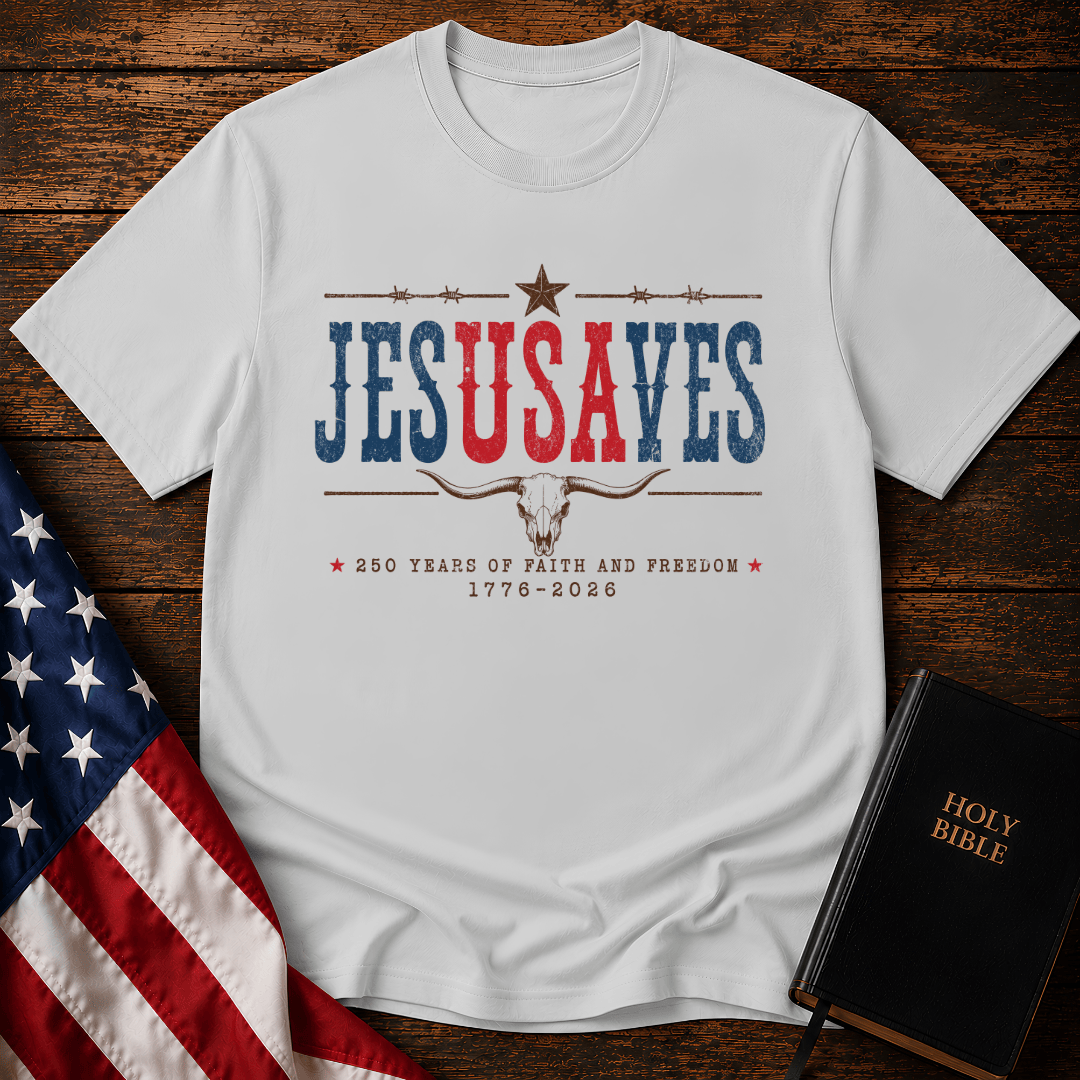 Patriotic sand colored graphic t shirt with Jesus Saves text, a longhorn skull, barbed wire, and American flag.