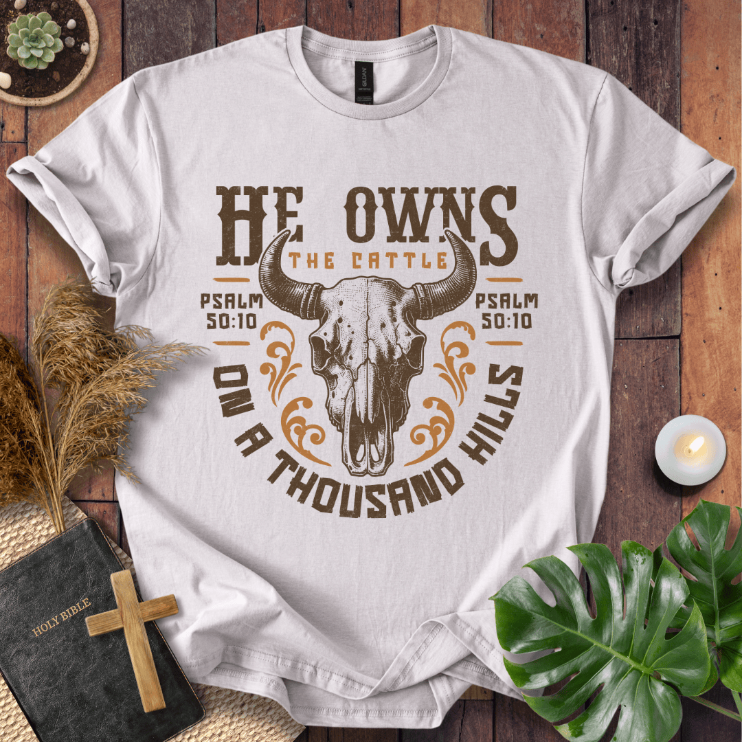 Christian t shirt for women featuring a longhorn skull and Psalm 50:10 He owns the cattle on a thousand hills.