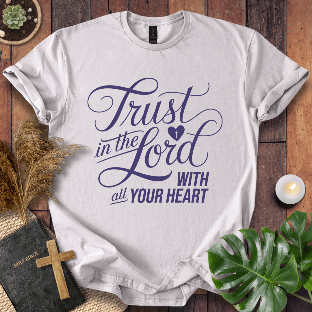 Proverbs 3:5 Trust in the Lord script design on a Christian t shirt for women styled with a bible and cross.
