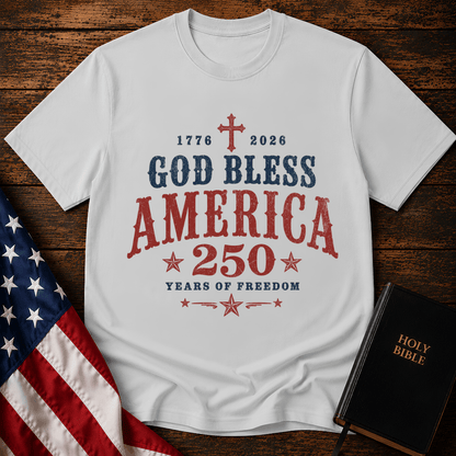 God Bless America 250 Years of Freedom t-shirt next to a Holy Bible and US flag