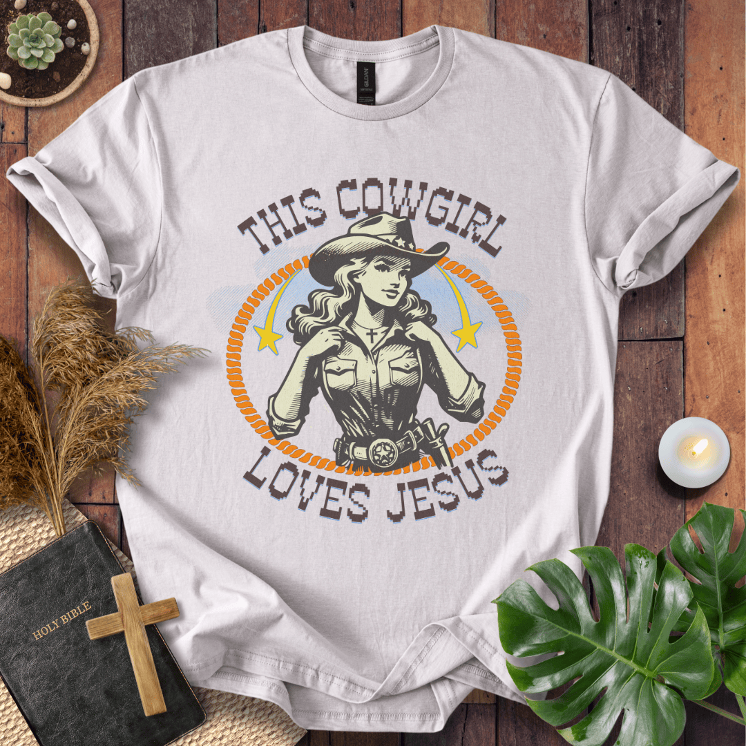 Christian t-shirt featuring a vintage cowgirl illustration with a lasso and the text This Cowgirl Loves Jesus.