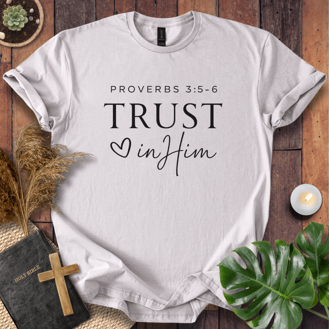 Minimalist Proverbs 3:5-6 Trust in Him shirt for women, a boho style bible verse t shirt on a wooden background.