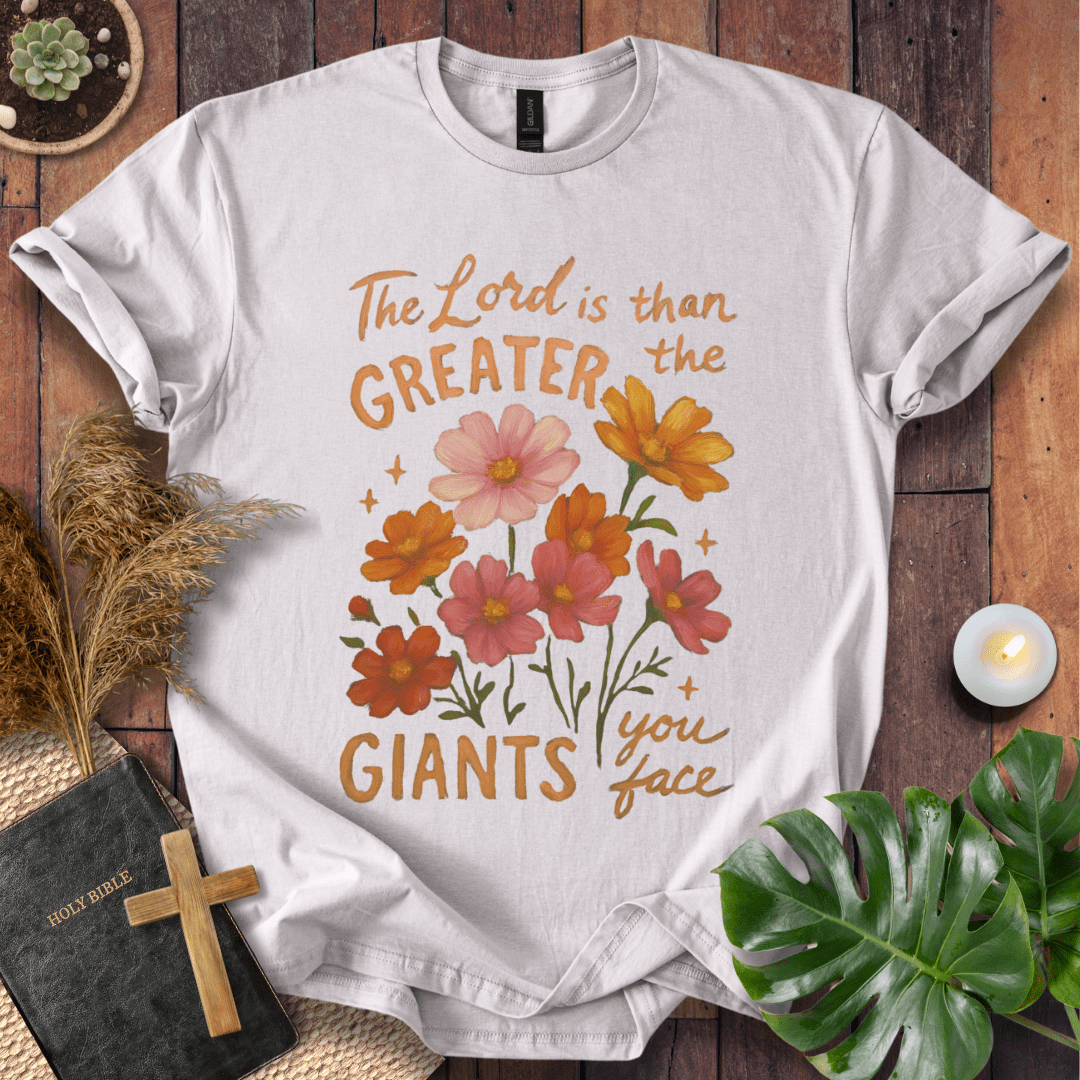 “The Lord is greater than the giants you face” floral lettering Christian t-shirt; uplifting faith tee.