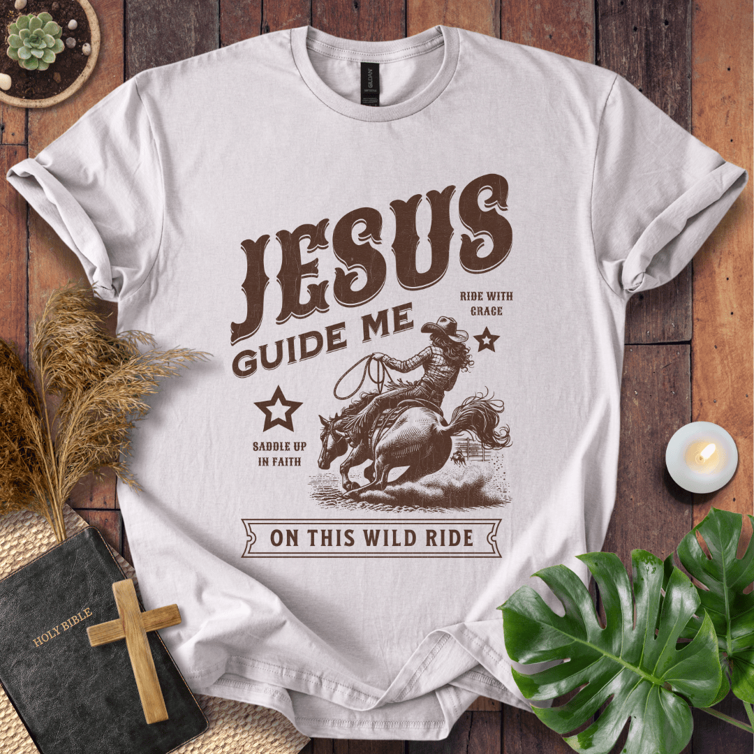 Vintage style t-shirt with a cowgirl riding a horse and text reading Jesus Guide Me On This Wild Ride.