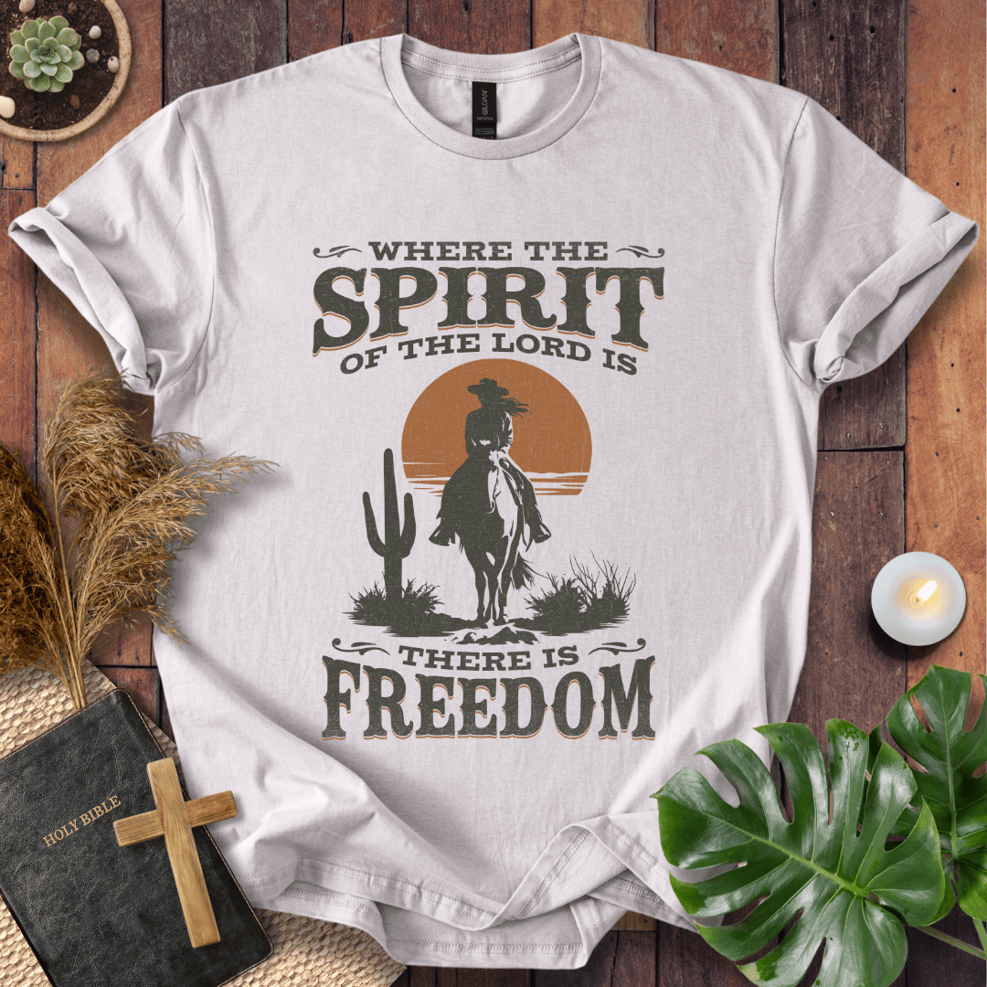 A Western tee featuring a horse rider, cactus, and sunset with the bible verse 2 Corinthians 3:17.