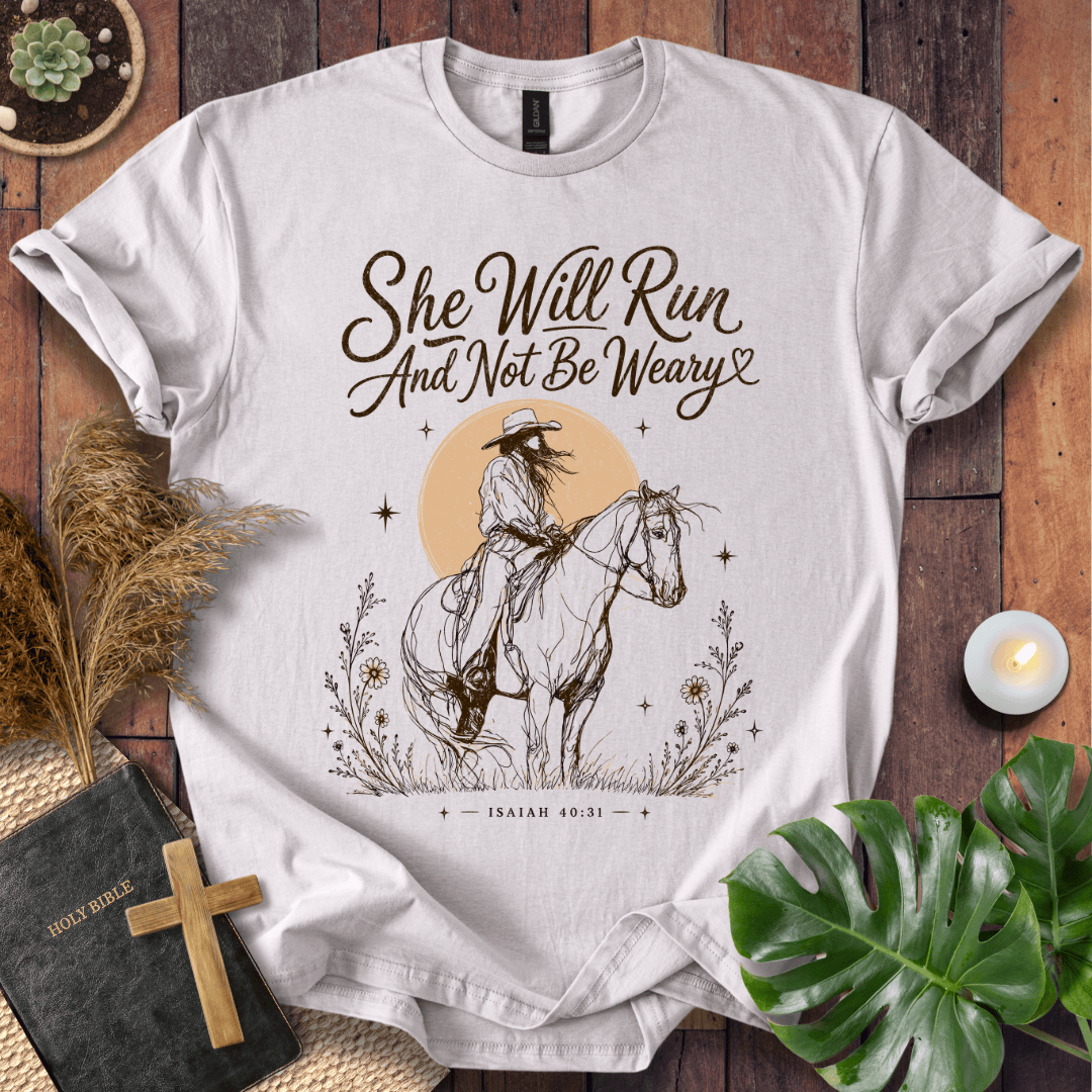 A vintage cream t-shirt featuring a sketched cowgirl on a horse under a desert sun with Isaiah 40:31.