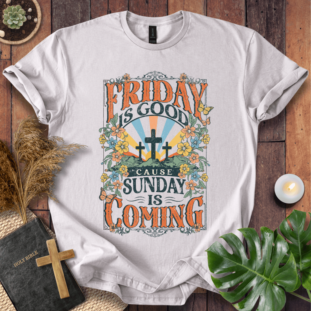 Christian Easter t-shirt featuring "Friday is Good Cause Sunday is Coming" vintage design with three crosses and wildflowers.