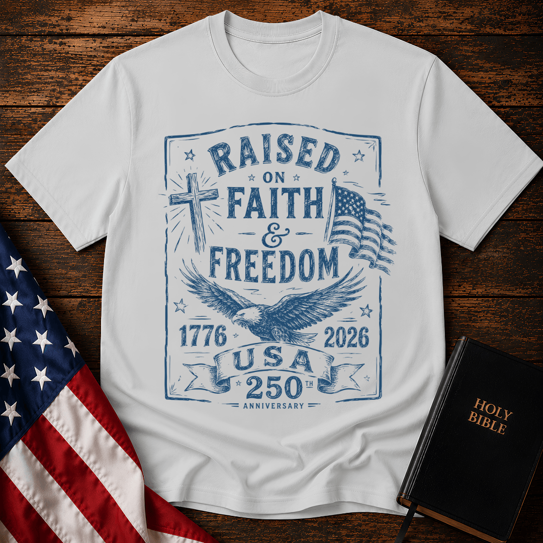 Patriotic Christian t shirts for women with a blue sketch of a cross, eagle, American flag, and 1776-2026.