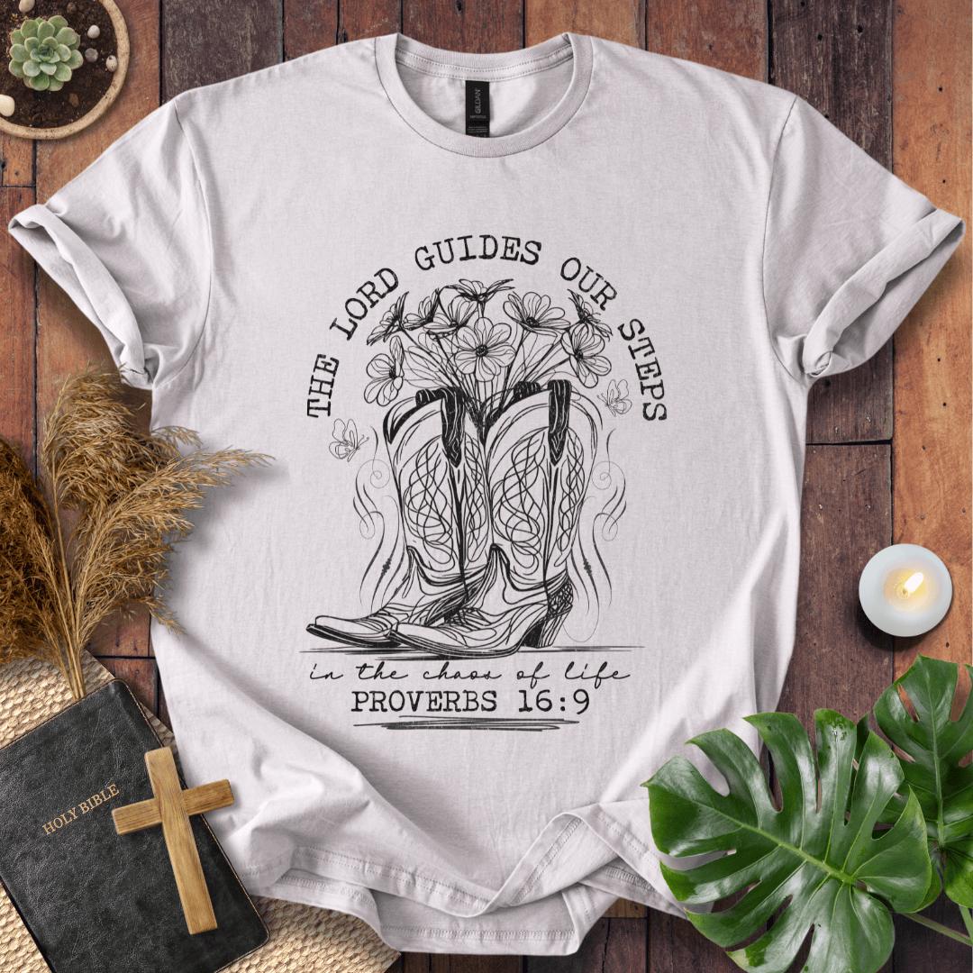 Western cowboy boots with wildflowers and butterflies on shirt with Proverbs 16:9 Bible verse text.