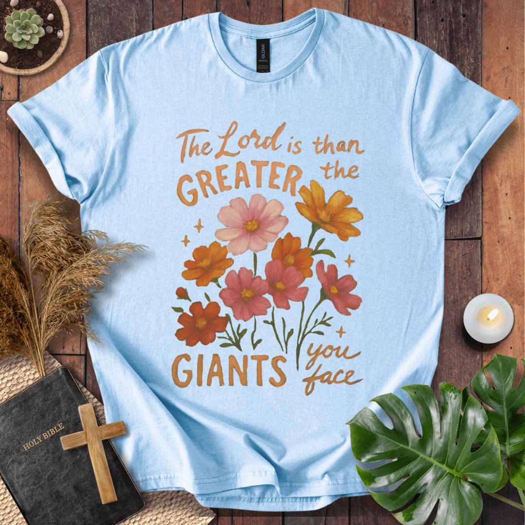 “The Lord is greater than the giants you face” floral lettering Christian t-shirt; uplifting faith tee.