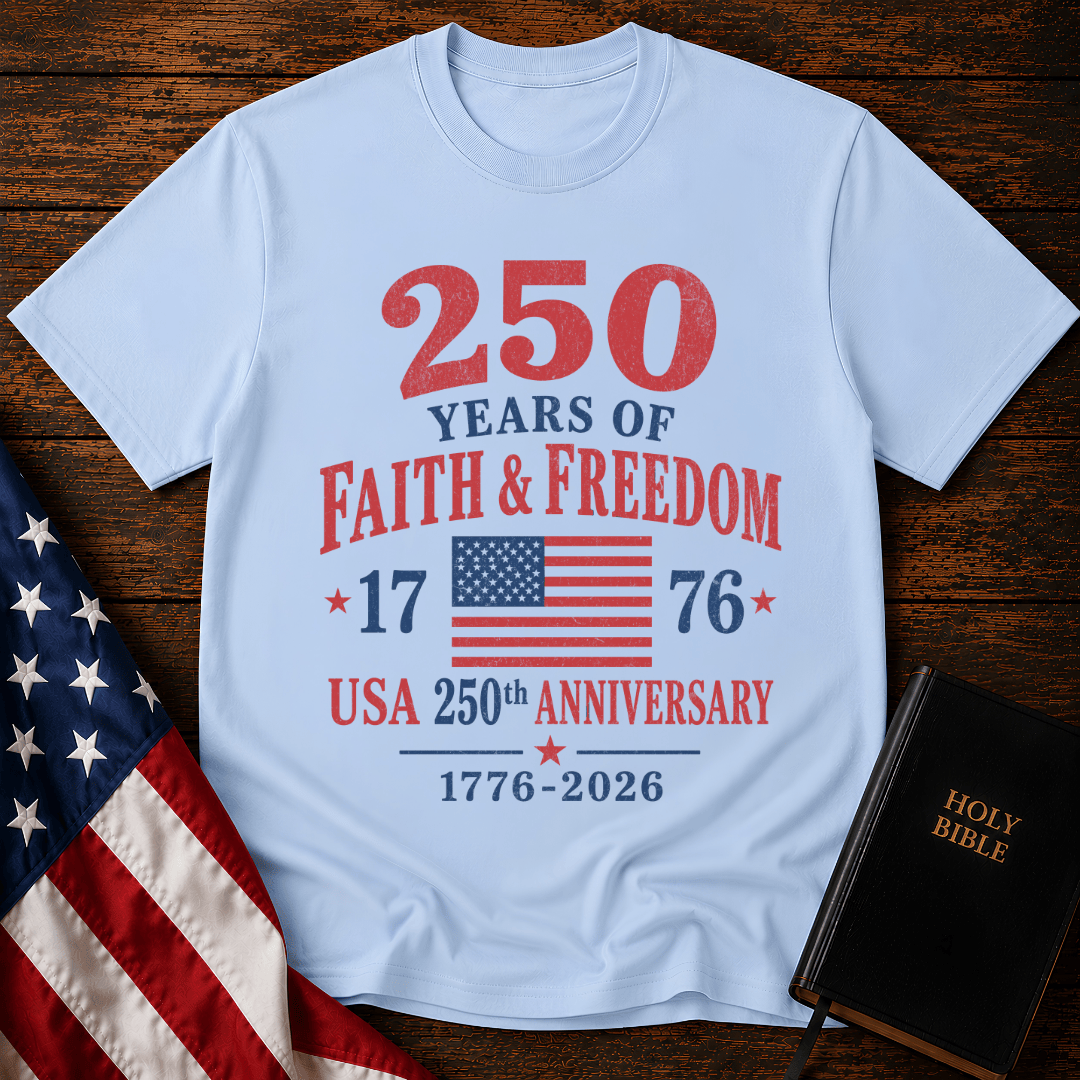 Patriotic t-shirt reading 250 Years of Faith and Freedom 1776 to 2026 with an American flag on a wood 