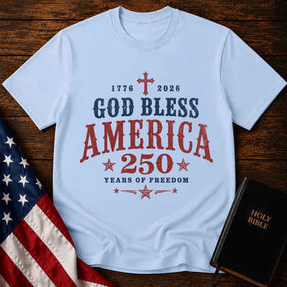 God Bless America 250 Years of Freedom t-shirt next to a Holy Bible and US flag
