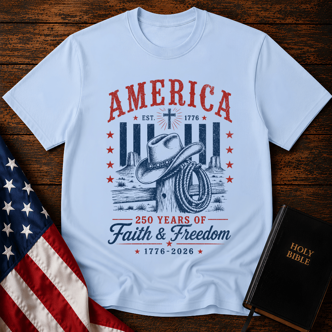 Patriotic Western graphic tee named featuring a cowboy hat, lasso, cross, and "250 Years of Faith & Freedom".