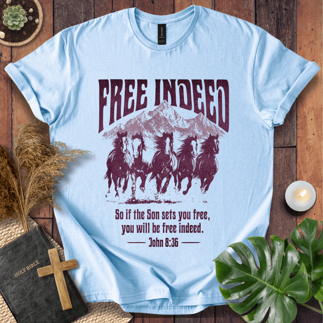t-shirt featuring five wild horses, mountains, and John 8:36 "Free Indeed" in a vintage distressed print.