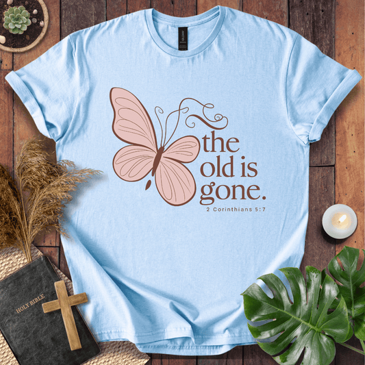 t-shirt with a dusty rose butterfly and "the old is gone" 2 Corinthians 5:17 text in brown ink.