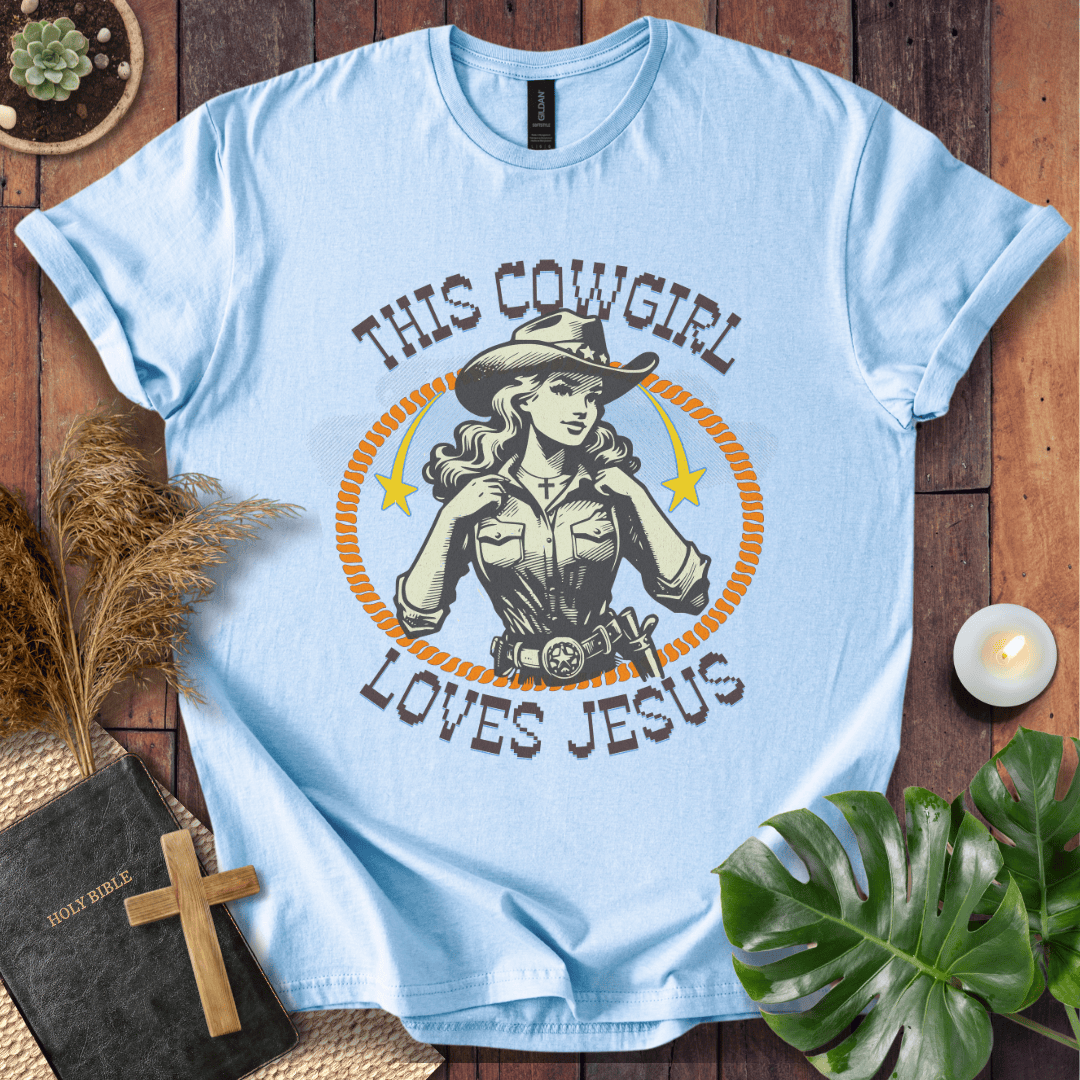 Christian t-shirt featuring a vintage cowgirl illustration with a lasso and the text This Cowgirl Loves Jesus.