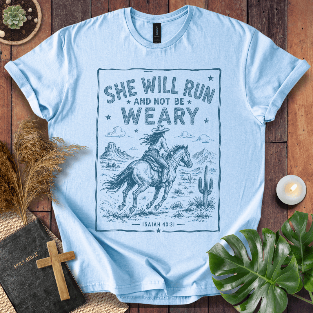 graphic tee with a blue sketch of a cowgirl riding a horse in the desert under Isaiah forty thirty-one text.