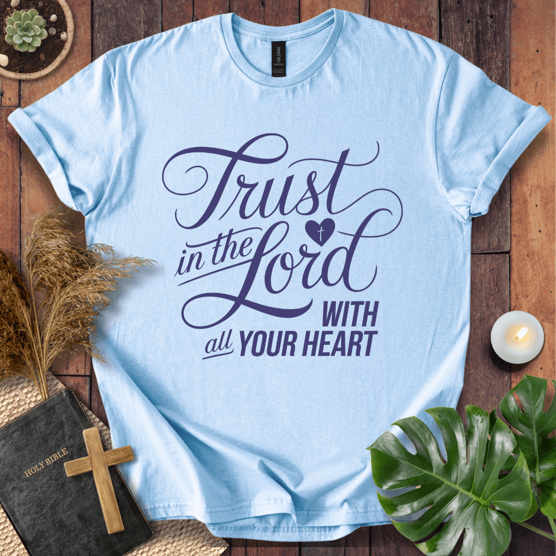 Proverbs 3:5 Trust in the Lord script design on a Christian t shirt for women styled with a bible and cross.